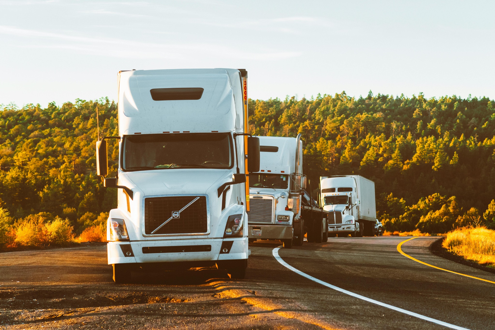 Heavy vehicles travelling along an open road